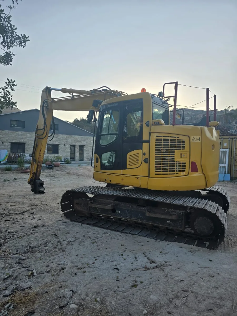 Excavator preparing ground on a site