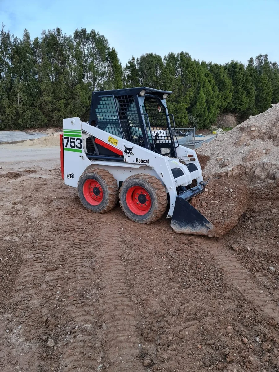 Heavy machinery preparing a construction site